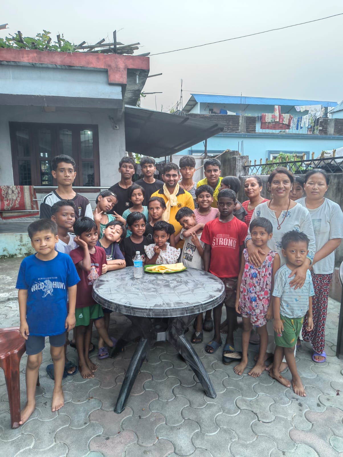 Community volunteers serving meals at Aama ko Bhansaghar